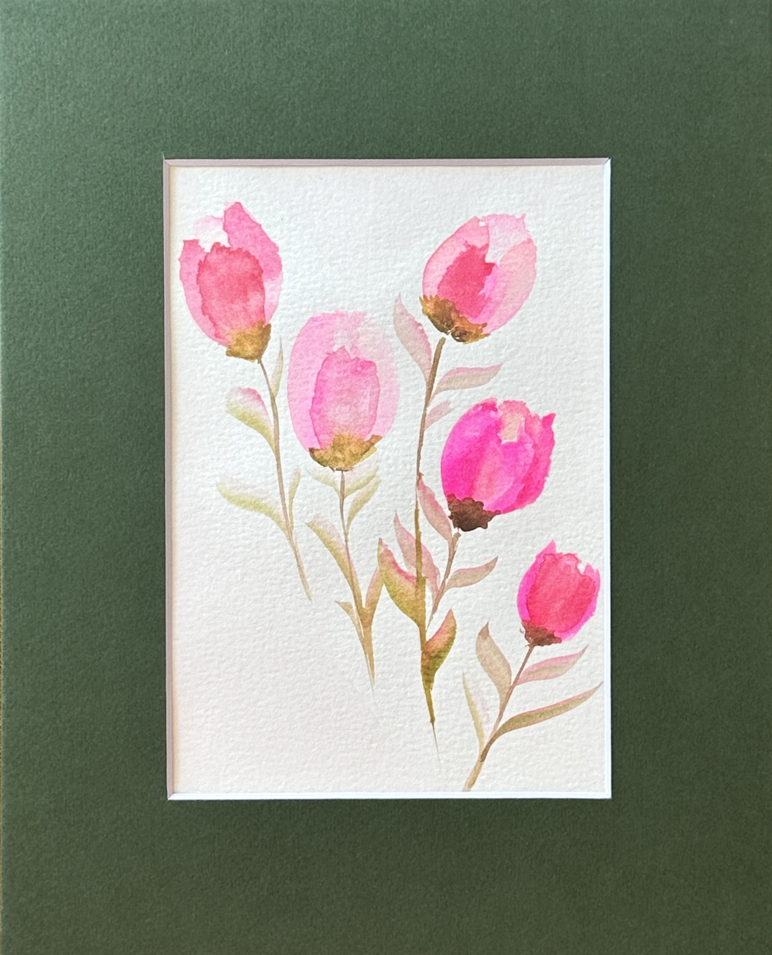 A pink tulip watercolor painting original with five blush and magenta tulips and soft sage stems, matted in forest green, by Céline